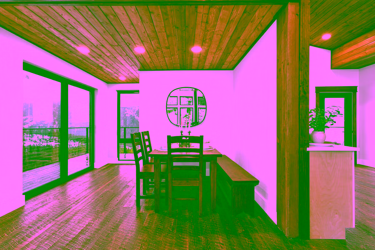 Dining nook with mountain view and wide-plank hardwood floors