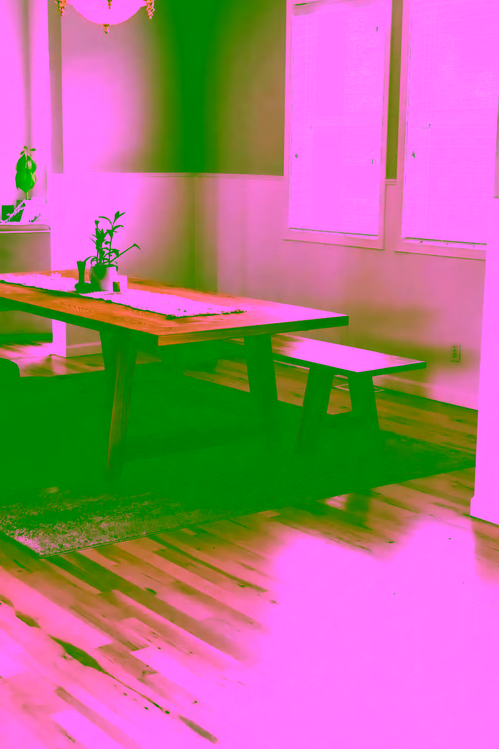 Restored 1920s fir floors beside a hearth
